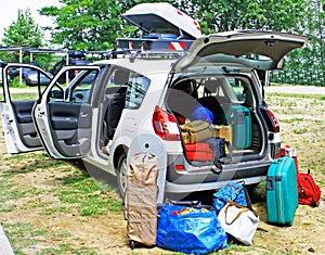 Family car loaded with luggage on holiday