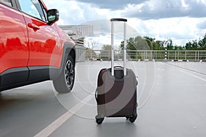 Family car and suitcase in the parking lot near the airport. Summer vacation concept, vacations