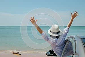 Family car trip at the sea, Asian woman feeling happiness.