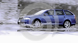 Family car on wet road