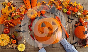 Family carving pumpkin. Halloween trick or treat