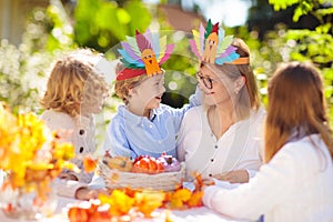 Family celebrating Thanksgiving. Kids crafts