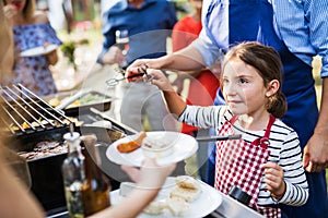 Family celebration or a barbecue party outside in the backyard.