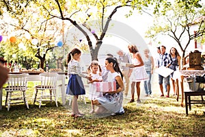 Family celebration or a garden party outside in the backyard.