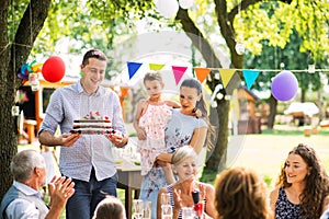 Family celebration or a garden party outside in the backyard.