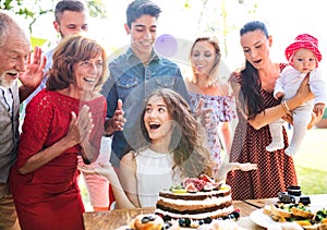 Family celebration or a garden party outside in the backyard.