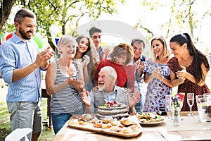 Family celebration or a garden party outside in the backyard.