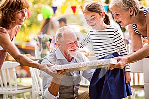 Family celebration or a garden party outside in the backyard.