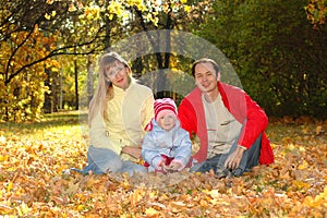 Family with child in autumn park