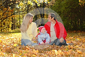 Family with child in autumn park