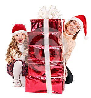 Family with child giving stack red gift box.