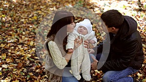 Family with child go in autumn park