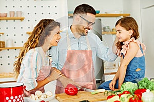 family child kitchen food daughter mother father cooking preparing breakfast happy together