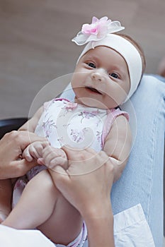 Family, child and motherhood concept - happy smiling mother with little baby daughter at home