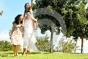 Family with child on shoulders