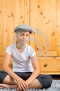 Family - child sitting with cap in room