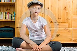 Family - child sitting with cap in room