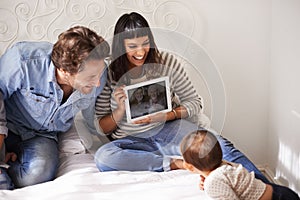 Family, child and toddler for video call in bedroom, internet and happy for grandparents on screen. Parents, baby and