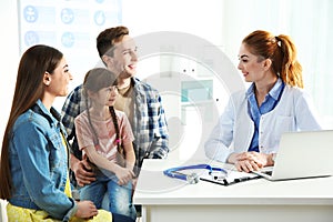 Family with child visiting doctor