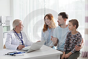 Family with child visiting doctor