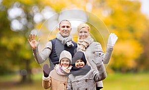 Happy family in autumn park