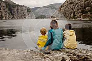 Family, children, adults and dog, enjoying  beach in Forsand, Lysebotn on a cloudy day