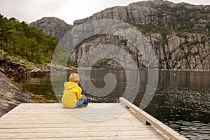 Family, children, adults and dog, enjoying beach in Forsand, Lysebotn on a cloudy day