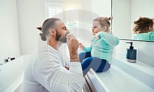 Family, children or brushing teeth with a father and girl in the bathroom of their home together or dental hygiene. Kids