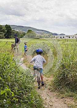 Family with children cycling