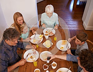 Family, children and eating food from above for healthy nutrition meal, wellness or bonding. Women, grandmother and