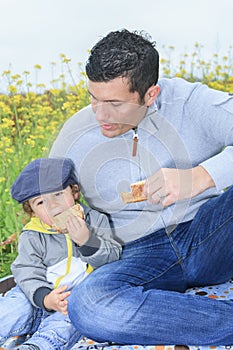 Family with children having picnic in autumn