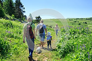 Family with children on a hike photo