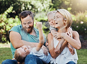 Family, children and nature with playing mother, kids and father in the park during summer, laughing and having fun