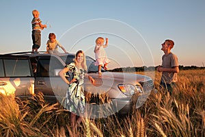 Family with children on offroad car