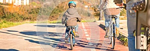 Family with children riding bicycles in the nature