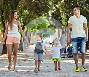 Family with childrens playing at park