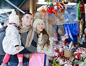 Family choosing christmas ornamentations.