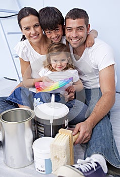 Family chosing colours to paint new house