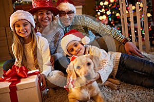 family, Christmas, holidays and new year concept - family holding gifts.