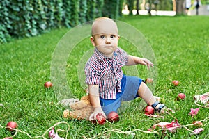 Family Christmas in July. Portrait of little boy near christmas tree. Baby decorating pine. Winter holidays and people concept.