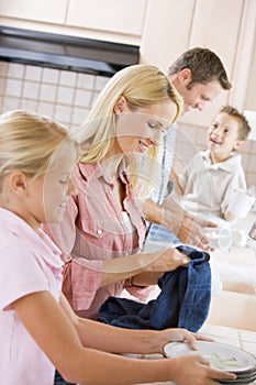 Family Cleaning Dishes Together