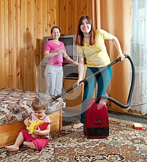 Family is cleans living room