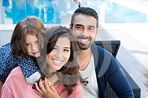 Family close to the pool