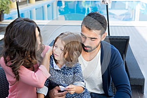 Family close to the pool