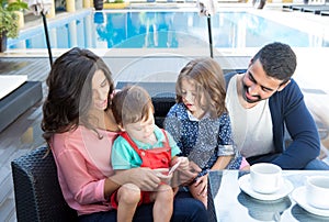 Family close to the pool