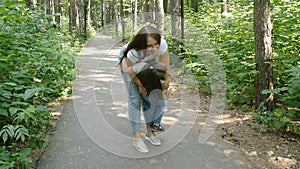 Family concept. Cute baby girl runs to Mom`s embrace in the park