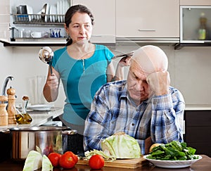 Family conflict. Mature man and angry woman during quarrel