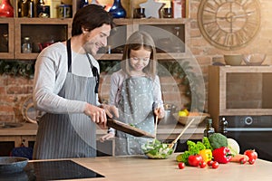 Family Cooking. Cheerful Dad And Little Daughter Preparing Healthy Lunch Together