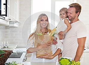 Family cooking in a modern kitchen setting