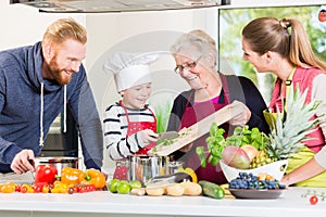 Family cooking in multigenerational household photo